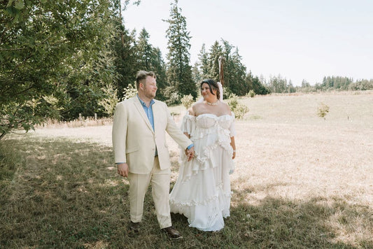 Ethan and Natasha on their wedding day, Natasha wearing her custom wedding dress by Madison Chamberlain