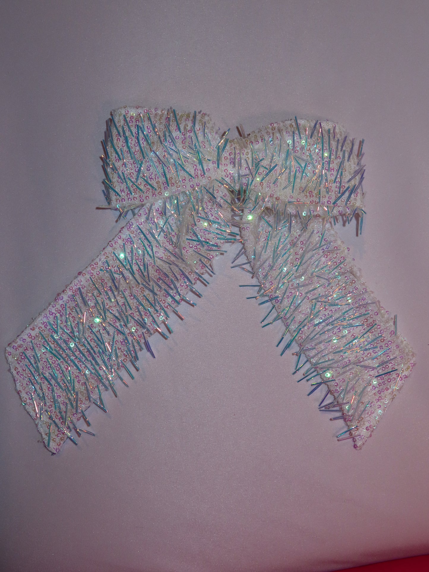 Fringey iridescent bow