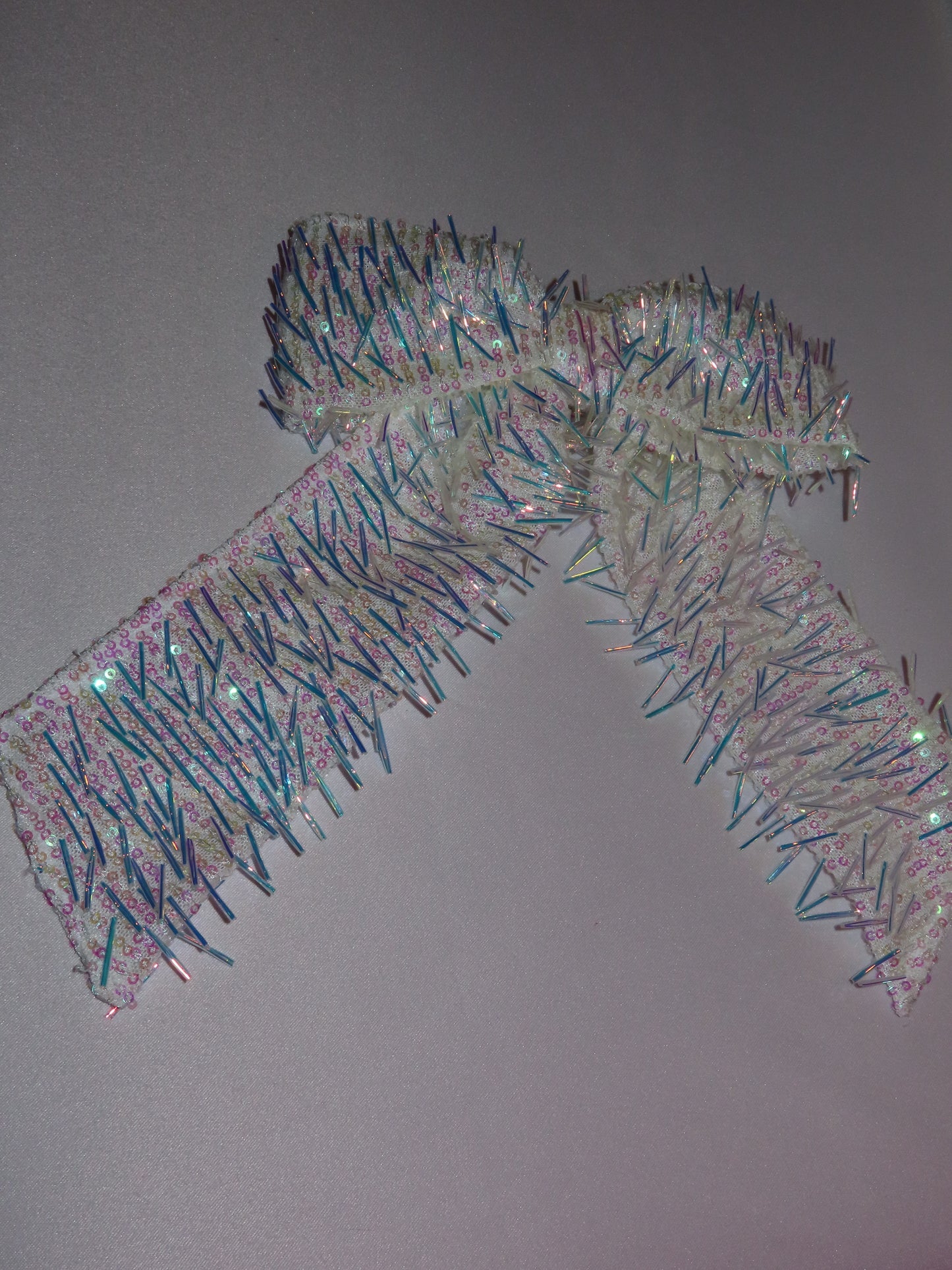 Fringey iridescent bow