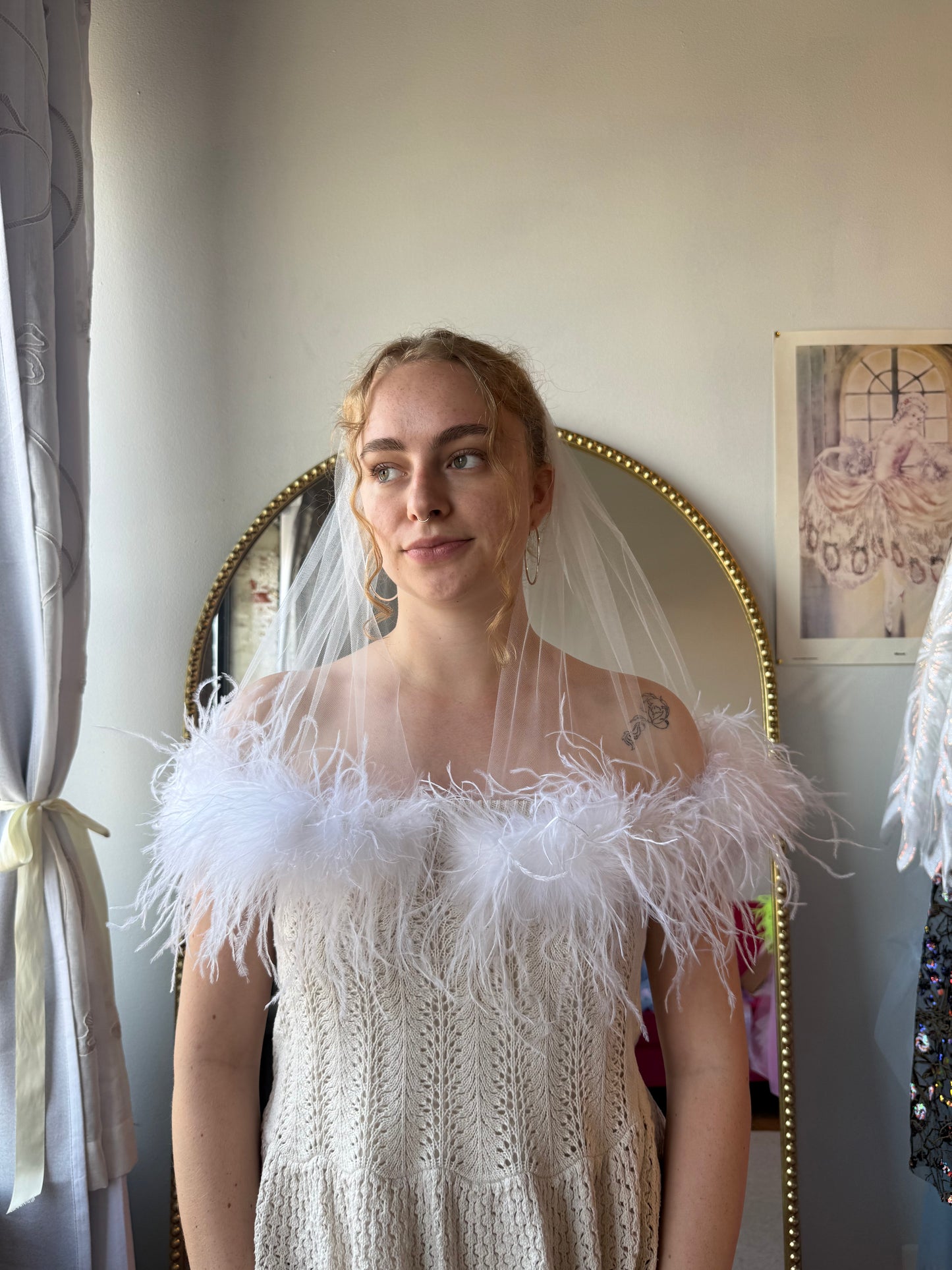 white fluffy feather veil