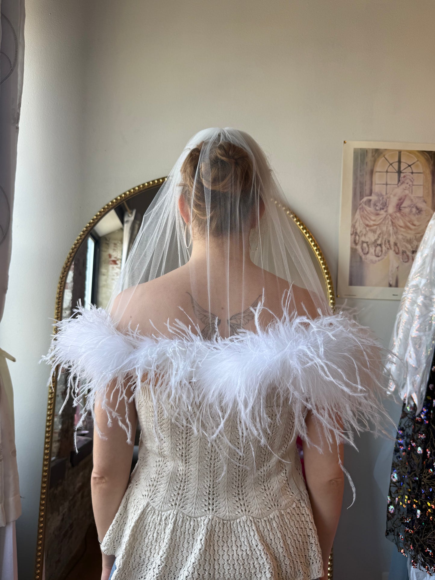 white fluffy feather veil